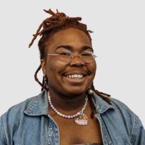 Photo of J Gourdin, smiling